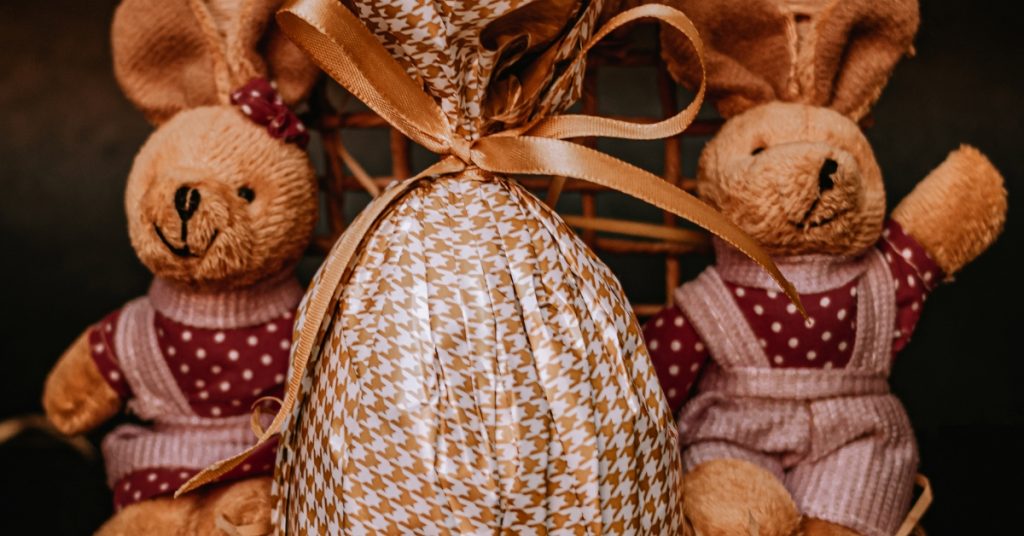 Cute Easter Bunnie soft toys and a wrapped luxury chocolate easter egg