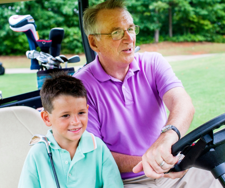 Kid and Grandfather on a Golf Buggy