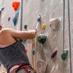 girl indoor rock climbing wall