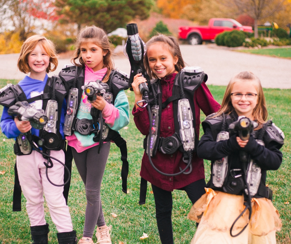 Kids with their laser tag gear on ready to play